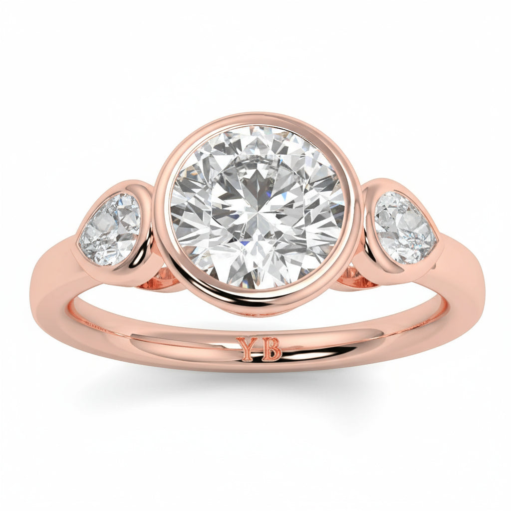 Rose gold ring with three diamonds on a white background yb jewellers vintage athena ring design with 3 round diamonds best selling design and trending engagement ring