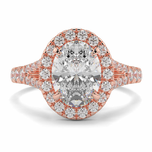Rose gold ring with a large diamond and smaller diamonds on a white background Yb jewellers oval diamond halo platinum diamond engagement ring bestseller trending design