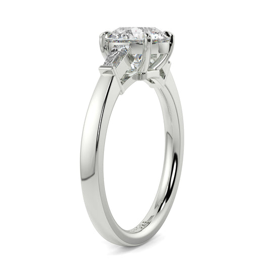 Diamond ring with a white gold band on a white background yb_jewellers_3_stone_trilogy_engagement_ring_round_and_pear_shape_best_selling_design_trending_diamond_ring