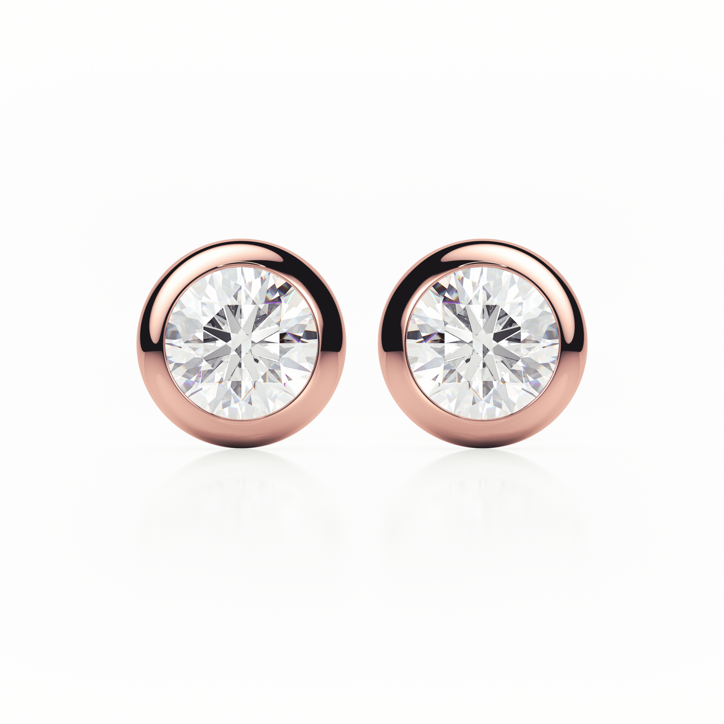 Rose gold earrings with clear gemstones on a white background