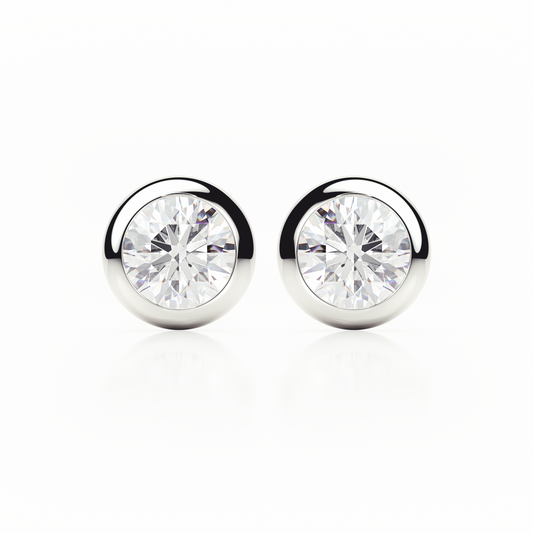 Pair of silver stud earrings with clear gemstones on a white background