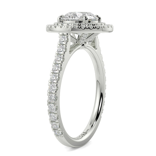 Diamond ring with a halo and pavé setting on a white background yb jewellers round double halo engagement ring best seller trending