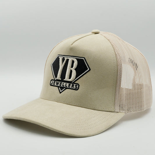 Beige cap with a black logo on a light gray background