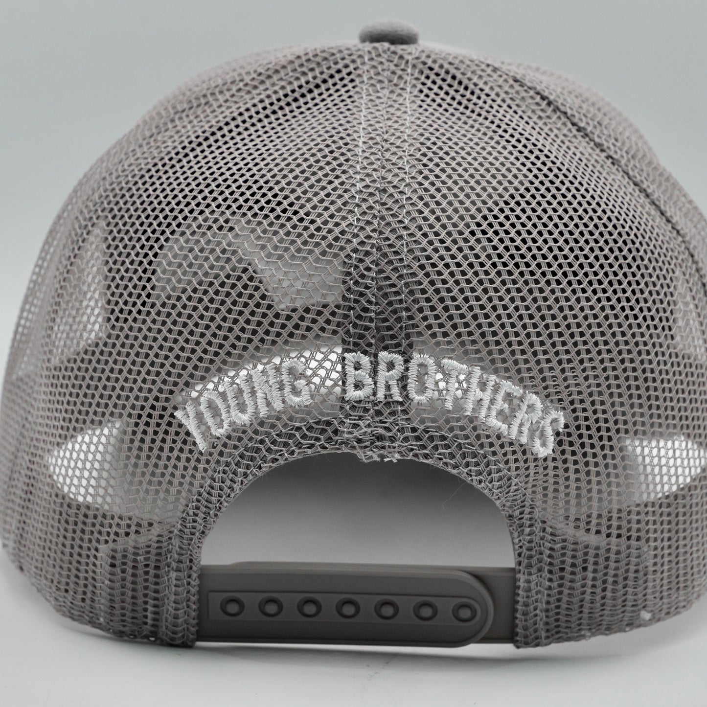 Gray mesh cap with 'Young Brothers' branding on a light gray background