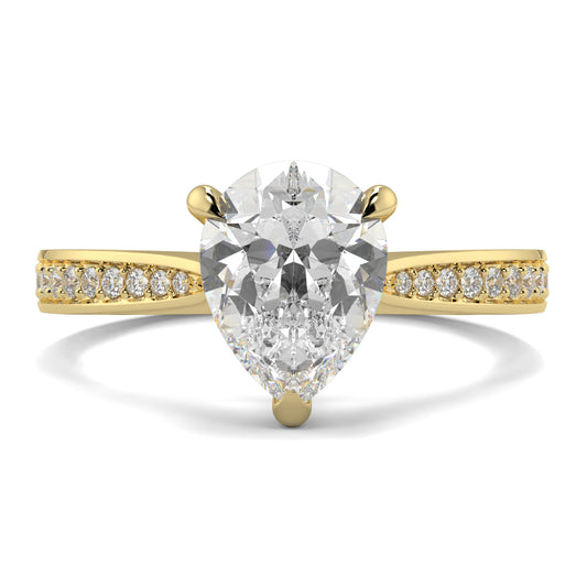Gold ring with a pear-shaped diamond and smaller diamonds on the band against a white background Yb jewellers engagement ring straight band