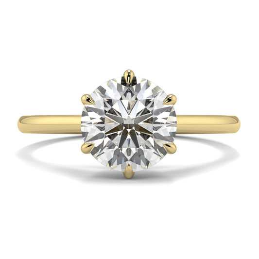 Gold ring with a large diamond on a white background yb jewellers solitaire engagement ring with 6 claws set similar to tiffany style classic engagement ring round solitare diamond ring yb jewellers trending jeweller and ring designs