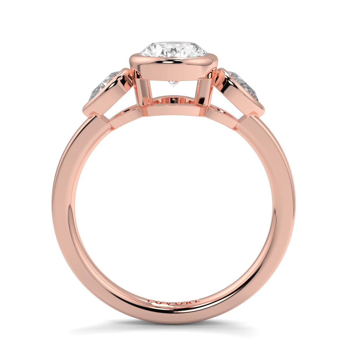 Rose gold ring with a diamond on a white background oval and pear diamond trilogy ring yb jewellers best selling design and engagement rings 