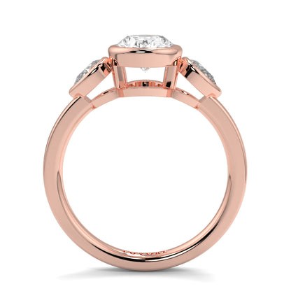 Rose gold ring with a diamond on a white background oval and pear diamond trilogy ring yb jewellers best selling design and engagement rings 