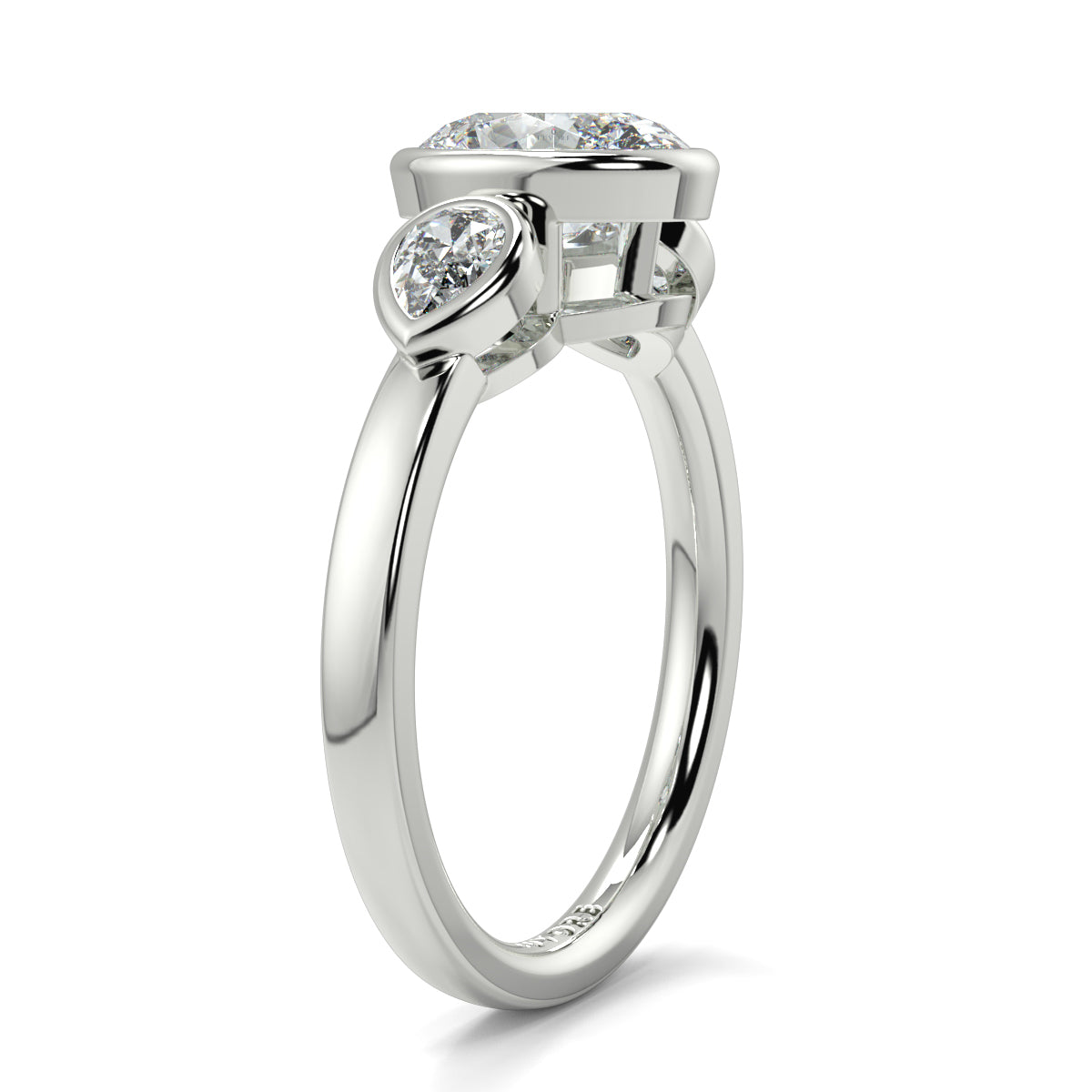 Diamond ring with three heart-shaped diamonds on a white background oval and pear diamond trilogy ring yb jewellers best selling design and engagement rings 