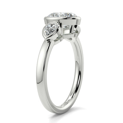 Diamond ring with three heart-shaped diamonds on a white background oval and pear diamond trilogy ring yb jewellers best selling design and engagement rings 