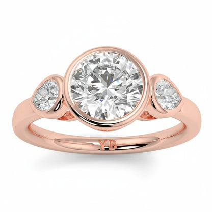 Rose gold ring with three diamonds on a white background yb jewellers vintage athena ring design with 3 round diamonds best selling design and trending engagement ring 