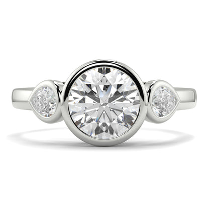 Silver ring with a large central diamond and two smaller diamonds on the sides against a white background yb jewellers vintage athena ring design with 3 round diamonds best selling design and trending engagement ring 