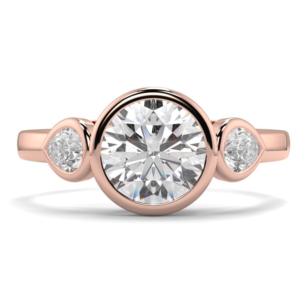 Rose gold ring with a central diamond and two smaller diamonds on a white background yb jewellers vintage athena ring design with 3 round diamonds best selling design and trending engagement ring 