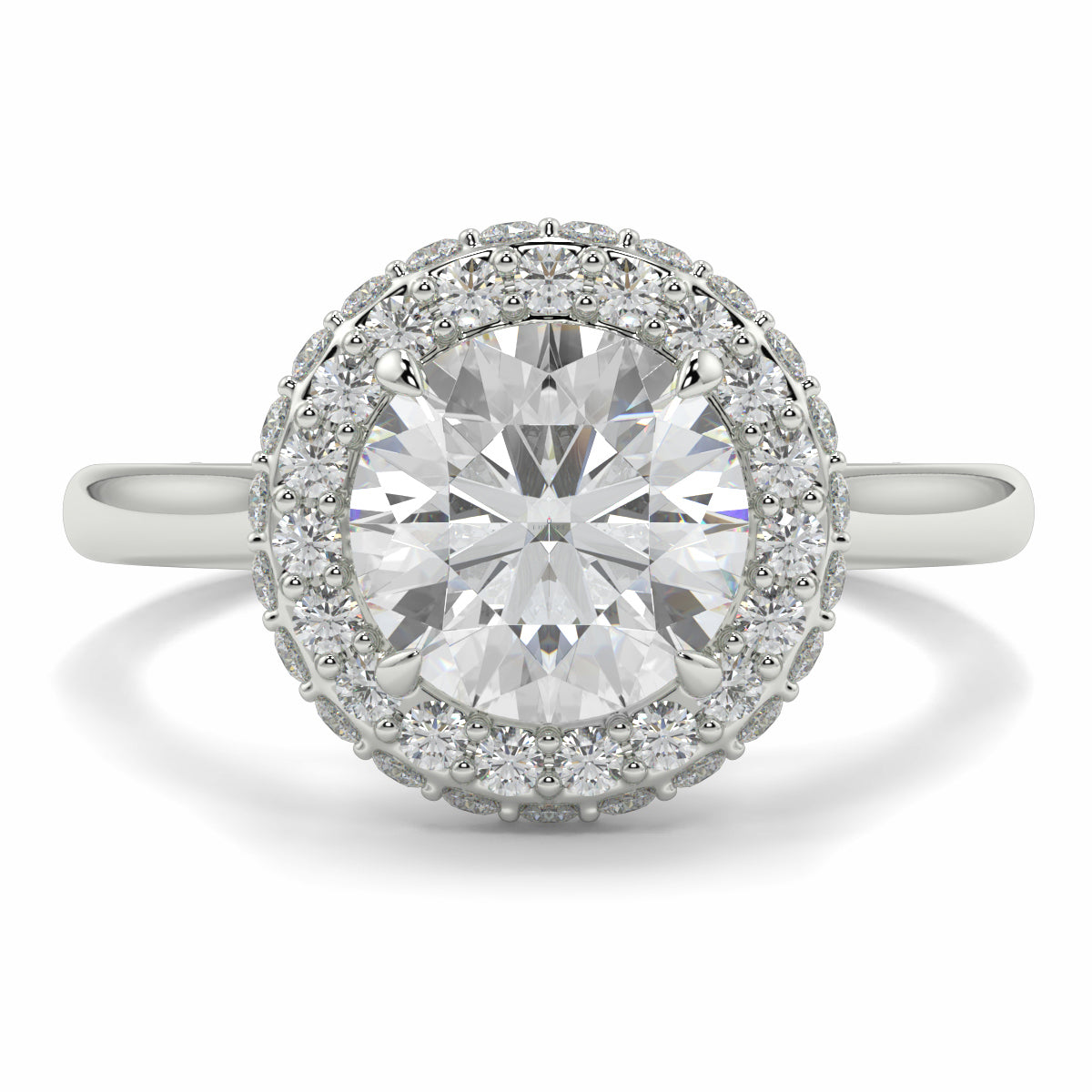 Diamond ring with a halo of smaller diamonds on a white background yb jewellers round diamond halo ring with plain shoulders trending bestseller design