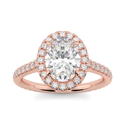 Rose gold ring with a large diamond and smaller diamonds on the band against a white background yb jewellers oval engagement ring best value