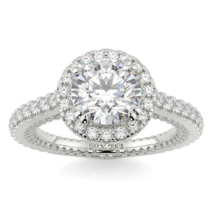 Diamond ring with a halo and intricate design on a white background round diamond halo engagement ring yb jewellers tiger claws vintage style