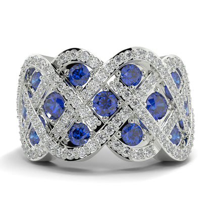 Silver ring with blue gemstones on a white background yb jewellers best selling eternity rin design in diamonds and sapphires micro setting diamond band 