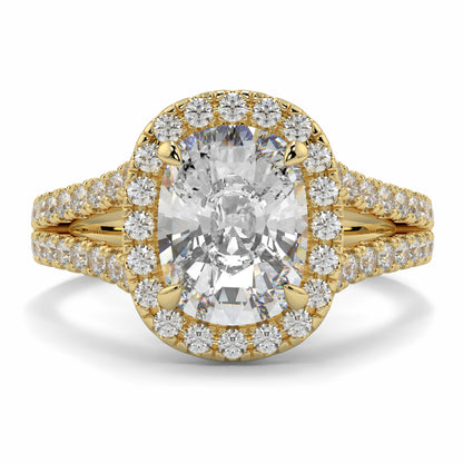Gold ring with a large central diamond and smaller diamonds around on a white background yb jewellers split halo diamond engagement ring best selling design trending cushion cut diamond