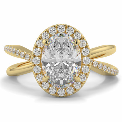 Gold ring with a large diamond and smaller diamonds around on a white background Yb jewellers oval diamond halo platinum diamond engagement ring bestseller trending design 