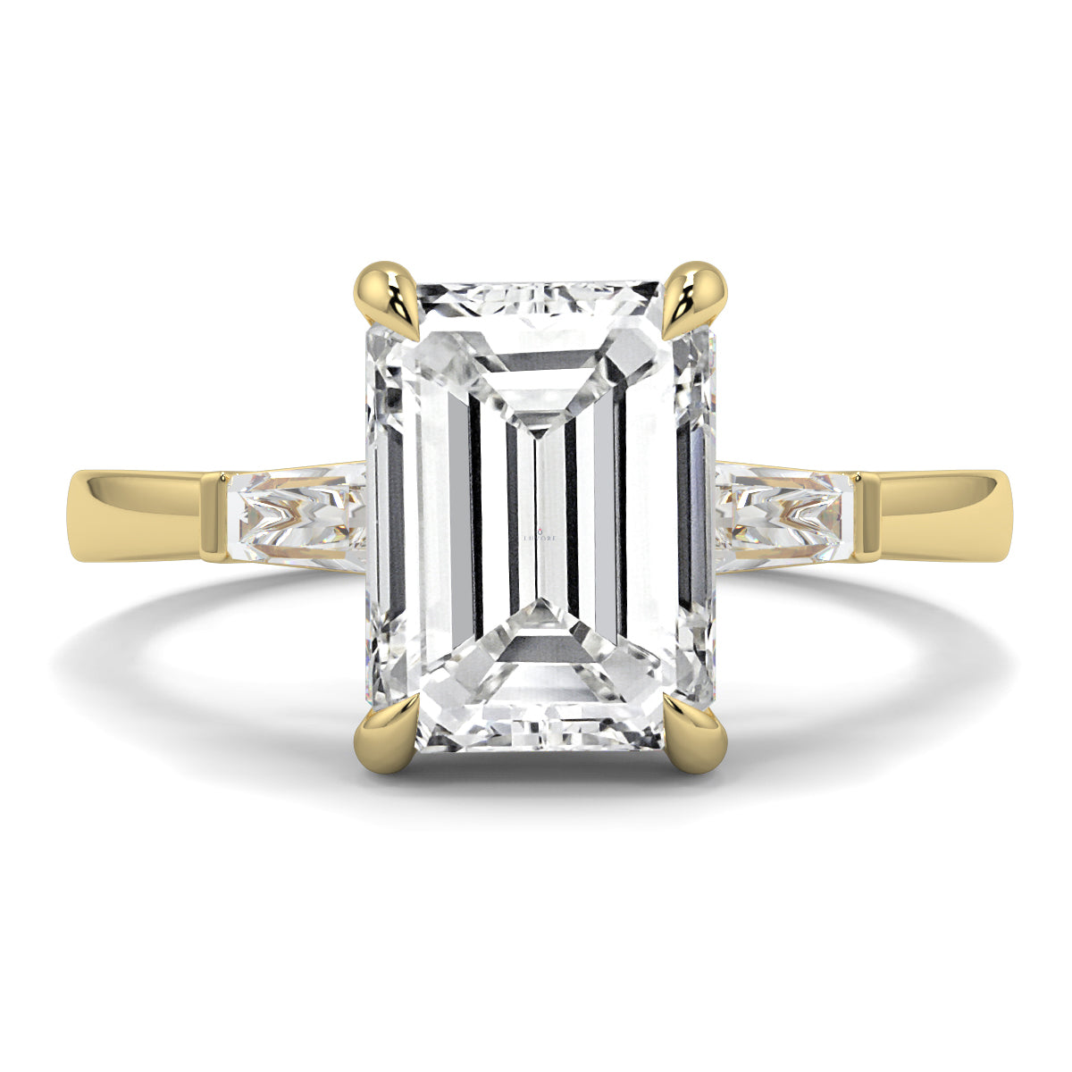 Gold ring with a large emerald-cut diamond on a white background yb_jewellers_3_stone_trilogy_engagement_ring_round_and_pear_shape_best_selling_design_trending_diamond_ring