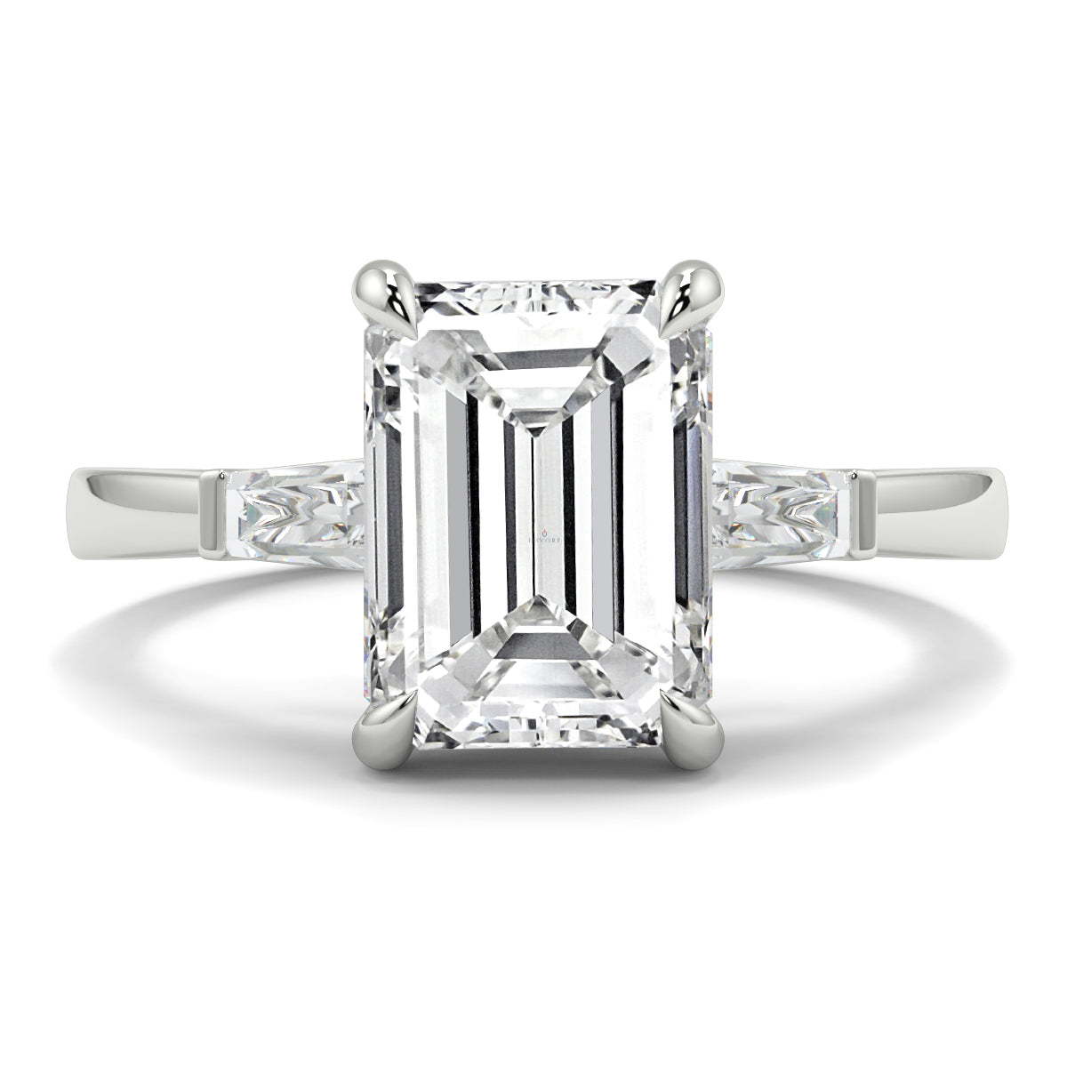 Diamond ring with emerald-cut center stone on a white background yb_jewellers_3_stone_trilogy_engagement_ring_round_and_pear_shape_best_selling_design_trending_diamond_ring