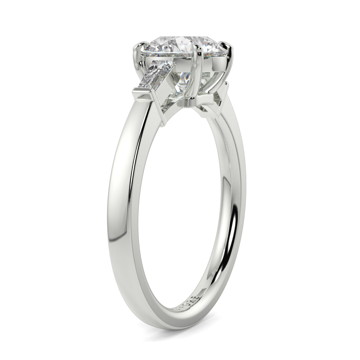 Diamond ring with a white gold band on a white background yb_jewellers_3_stone_trilogy_engagement_ring_round_and_pear_shape_best_selling_design_trending_diamond_ring