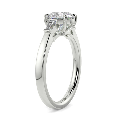 Diamond ring with a white gold band on a white background yb_jewellers_3_stone_trilogy_engagement_ring_round_and_pear_shape_best_selling_design_trending_diamond_ring