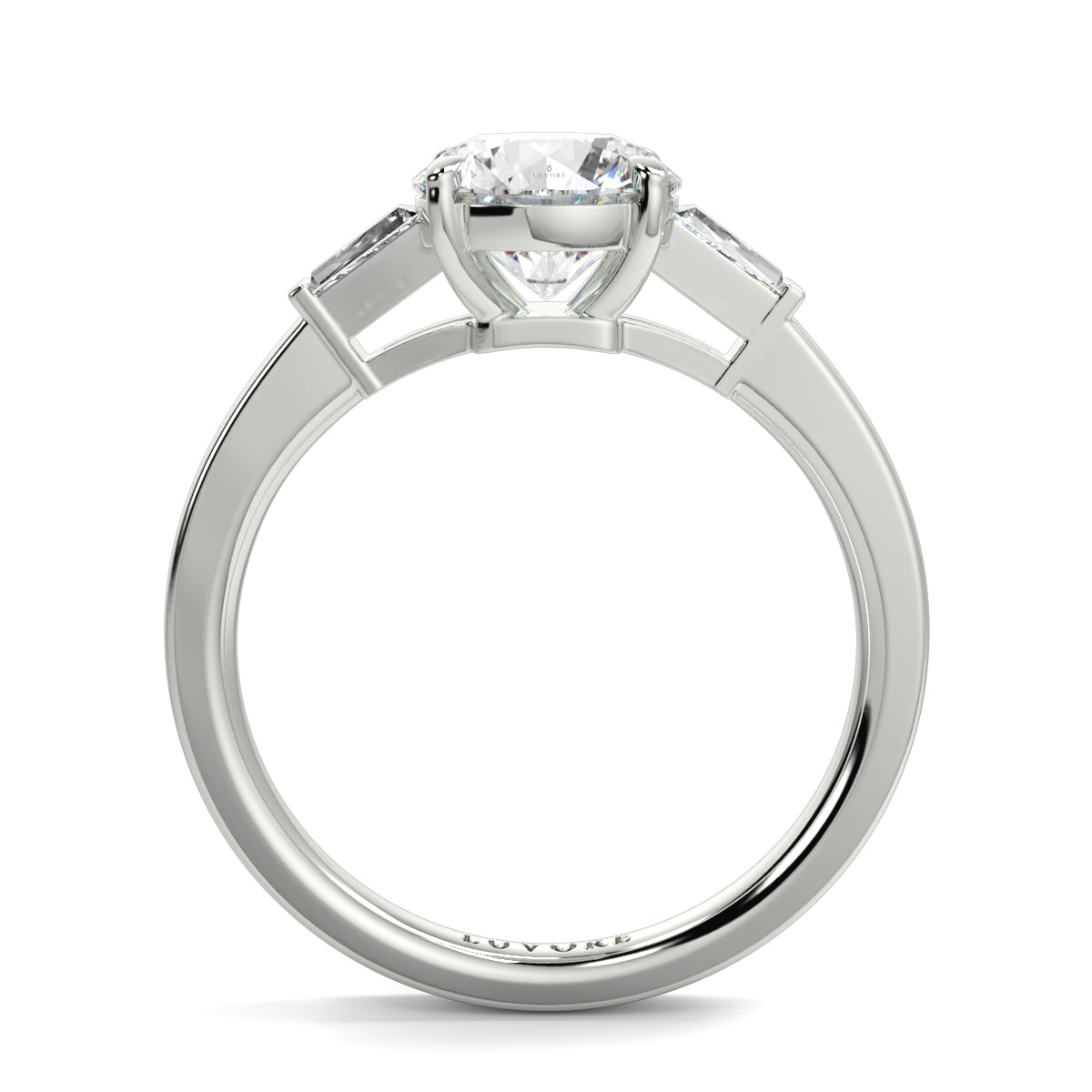 Diamond ring with a white gold band on a white background yb_jewellers_3_stone_trilogy_engagement_ring_round_and_pear_shape_best_selling_design_trending_diamond_ring