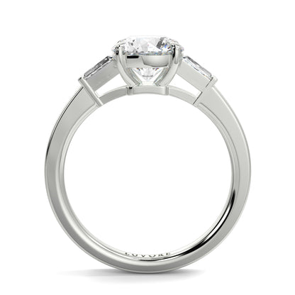 Diamond ring with a white gold band on a white background yb_jewellers_3_stone_trilogy_engagement_ring_round_and_pear_shape_best_selling_design_trending_diamond_ring