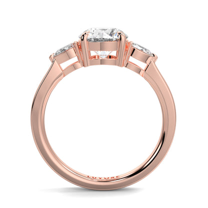 Rose gold ring with a diamond on a white background yb jewellers 3 stone trilogy engagement ring round and pear shape best selling design trending diamond ring
