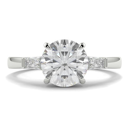 Diamond ring with a white background yb_jewellers_3_stone_trilogy_engagement_ring_round_and_pear_shape_best_selling_design_trending_diamond_ring