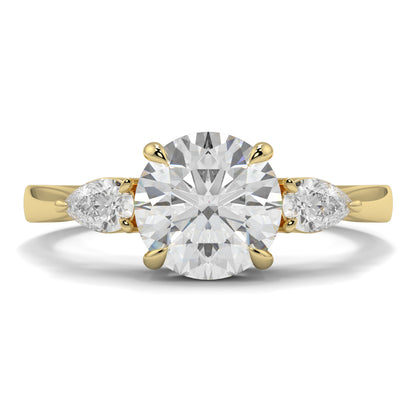 Gold ring with a large diamond and two smaller diamonds on a white background yb jewellers 3 stone trilogy engagement ring round and pear shape best selling design trending diamond ring