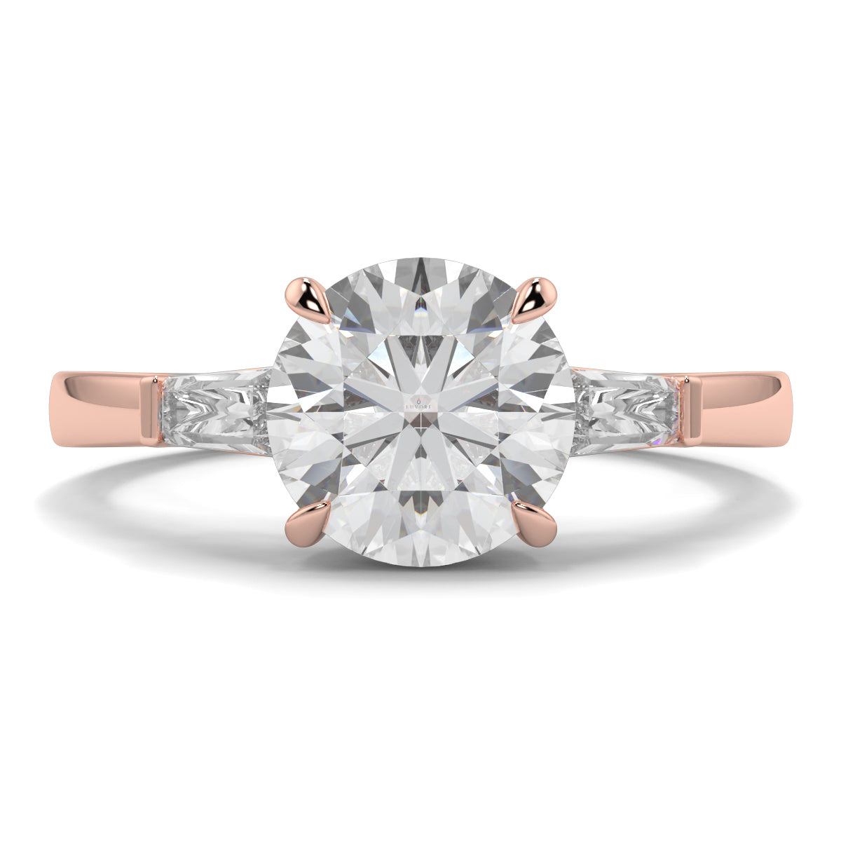 Rose gold ring with a large diamond on a white background yb_jewellers_3_stone_trilogy_engagement_ring_round_and_pear_shape_best_selling_design_trending_diamond_ring
