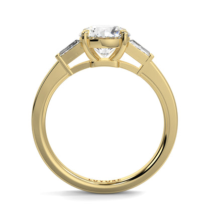 Gold ring with a diamond on a white background yb_jewellers_3_stone_trilogy_engagement_ring_round_and_pear_shape_best_selling_design_trending_diamond_ring