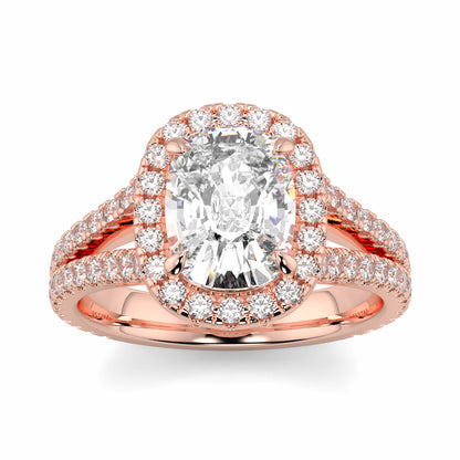 Rose gold ring with a large diamond and smaller diamonds on a white background yb jewellers split halo diamond engagement ring best selling design trending cushion cut diamond