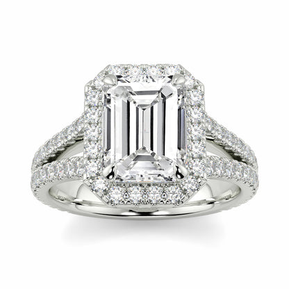 Diamond ring with emerald-cut center stone on a white background Yb jewellers emerald split halo diamond engagement ring 