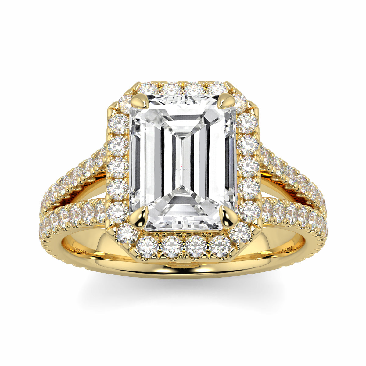 Gold ring with emerald-cut diamond and smaller diamonds on a white background Yb jewellers emerald split halo diamond engagement ring 
