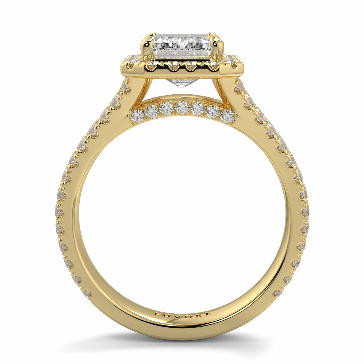 Gold ring with diamond accents on Yb jewellers emerald split halo diamond engagement ring a white background 