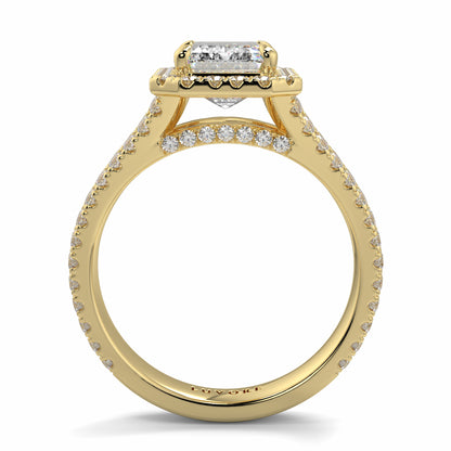 Gold ring with diamond accents on Yb jewellers emerald split halo diamond engagement ring a white background 