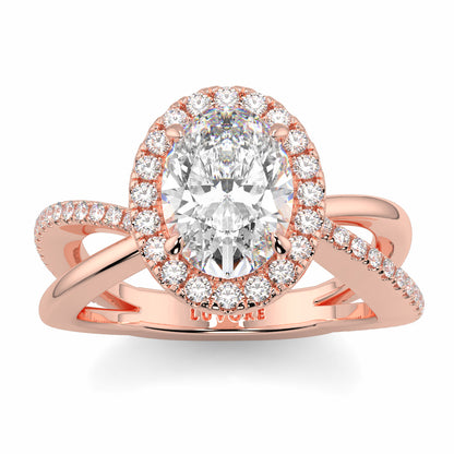 Rose gold ring with a large diamond and smaller diamonds on a white background Yb jewellers oval diamond halo platinum diamond engagement ring bestseller trending design 