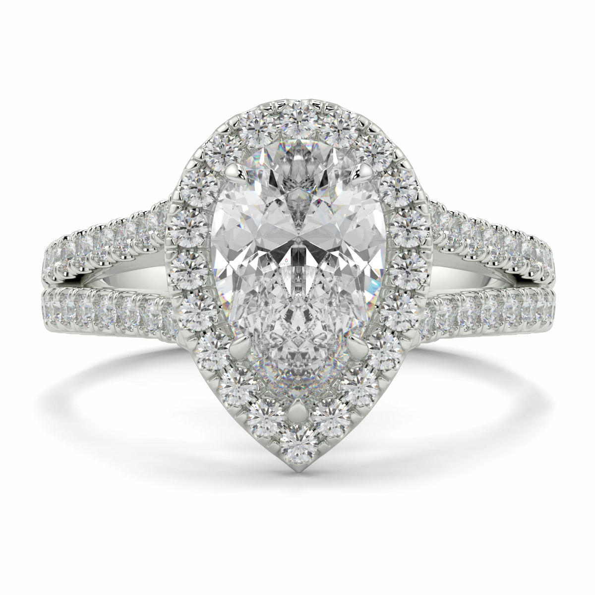 Diamond ring with a pear-shaped center stone on a white background n yb jewellers twist halo pear shape engagement diamond ring best selling design ring and trending design 2026