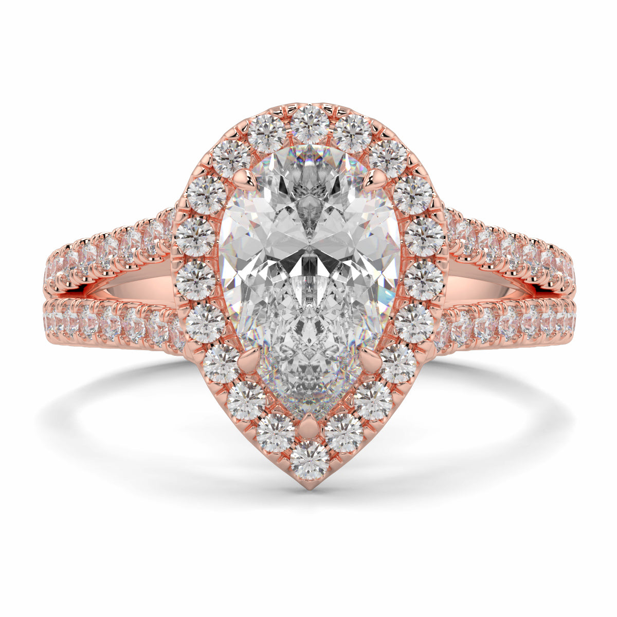 Rose gold diamond ring with a pear-shaped center stone on a white background yb jewellers twist halo pear shape engagement diamond ring best selling design ring and trending design 2026