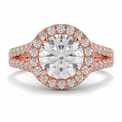 Rose gold diamond ring with a large central gemstone and smaller diamonds on a white background yb jewellers twist halo round shape engagement diamond ring best selling design ring and trending design 2026