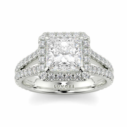 Diamond ring with a prominent central gemstone and smaller stones on a white background yb jewellers twist halo princess shape engagement diamond ring best selling design ring and trending design 2026