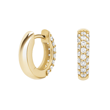 Gold hoop earrings with embedded stones on a green background pair of huggiee earrings in 18k white gold platinum with micro diamond setting by yb jewellers 