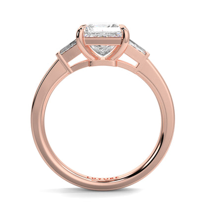 Rose gold ring with a diamond on a white background yb_jewellers_3_stone_trilogy_engagement_ring_round_and_pear_shape_best_selling_design_trending_diamond_ring