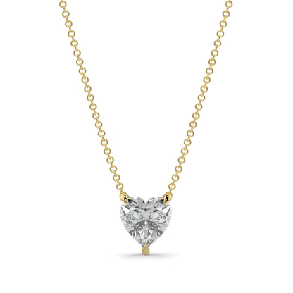 Heart-shaped diamond pendant on a gold chain against a white background 