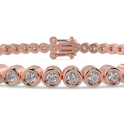 Rose gold bracelet with diamond accents on a white background Diamond_Bracelet_Rubover_bezel_set_yb Jewellers_platinum_rose_gold_y