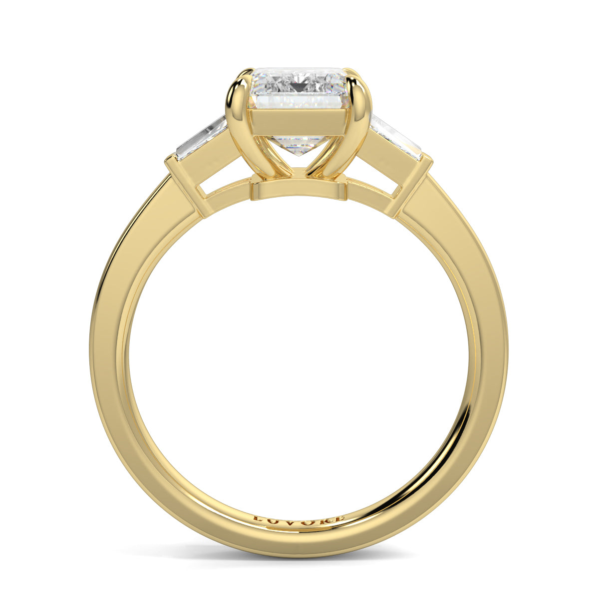 Gold ring with a diamond on a white background yb_jewellers_3_stone_trilogy_engagement_ring_round_and_pear_shape_best_selling_design_trending_diamond_ring