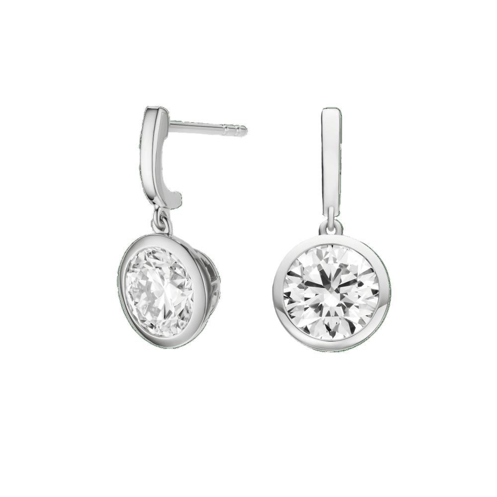 Pair of silver earrings with clear gemstones on a green background  yb jewellers yellow gold diamond drop earrings rubover setting 